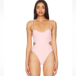Pink and lace one piece, cut out lace swimsuit designed by Tularose
